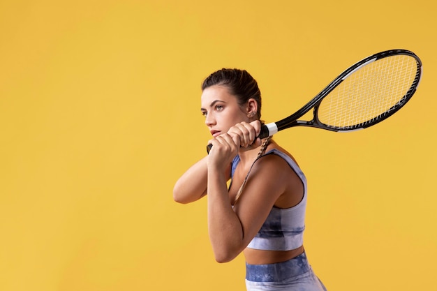 Young female tennis player with racket