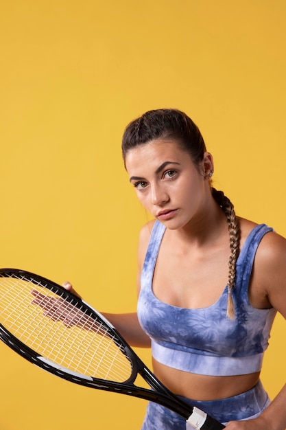 Young female tennis player with racket