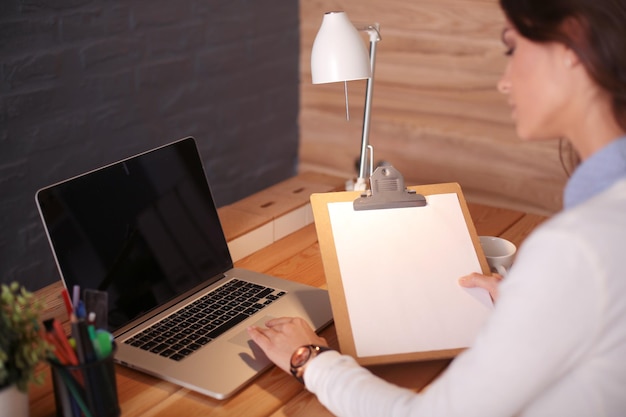 Young female working sitting at a desk