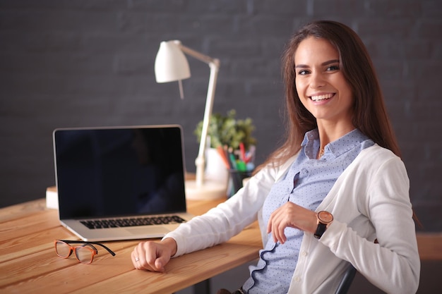 Young female working sitting at a desk