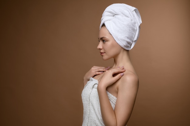 Young female wrapped in towel