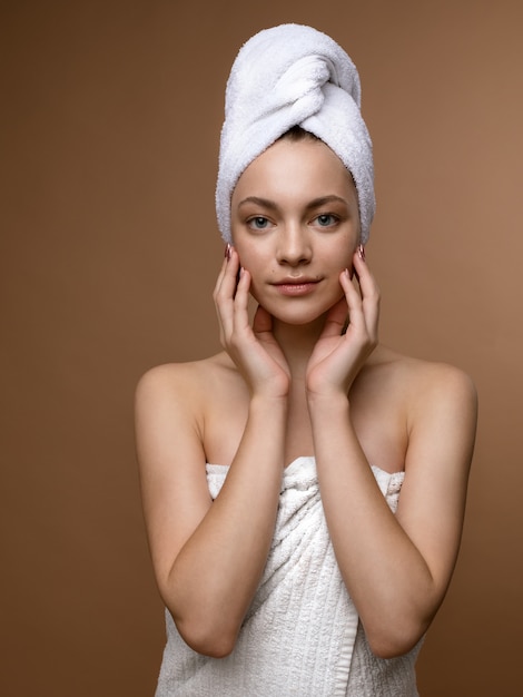 Young female wrapped in towel