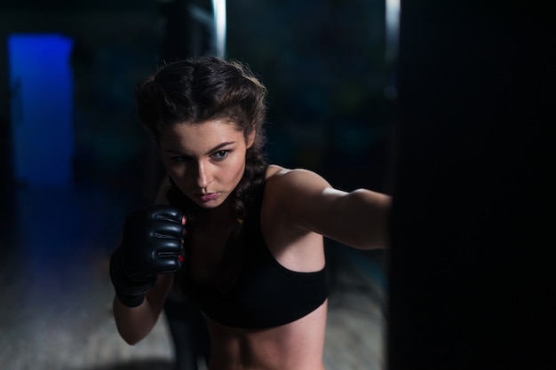 Young fighter boxer Moment before punch Woman power