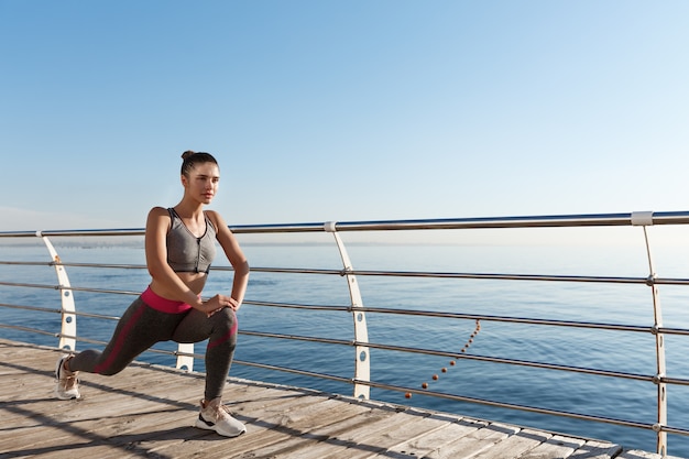 Young fit sportswoman working out