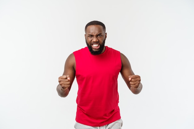 Young fitness african black man in sport wear cheering carefree and excited, Victory concept.