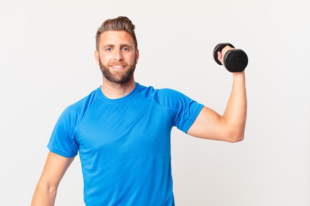 young fitness man lifting a dumbbell