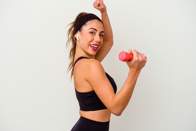 Young fitness woman with dumbbells isolated on white background