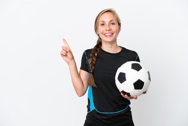 Young football player woman isolated on white background pointing to the side to present a product