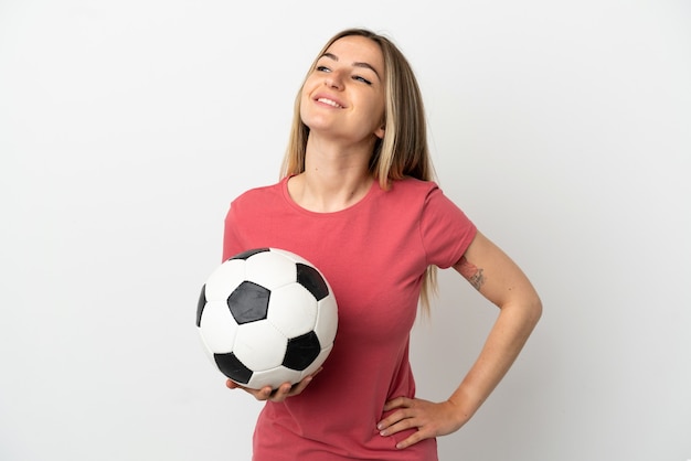 Young football player woman over isolated white wall posing with arms at hip and smiling