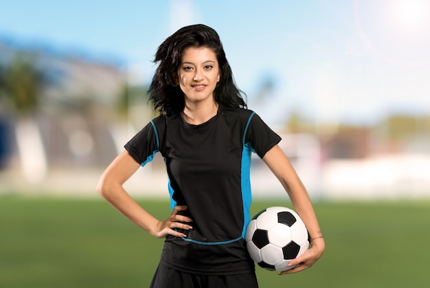 Young football player woman