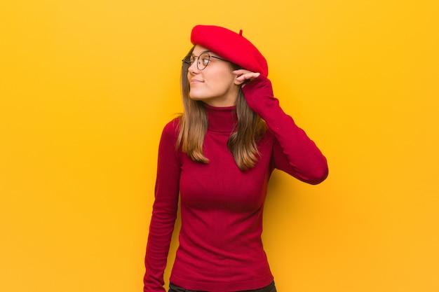 Young french artist woman try to listening a gossip