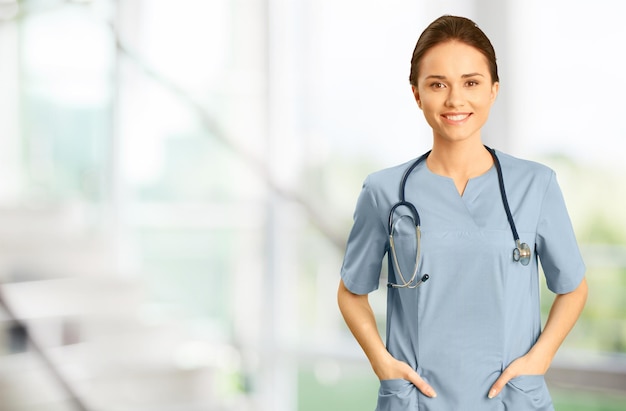 Young Friendly Nurse in Blue Scrubs