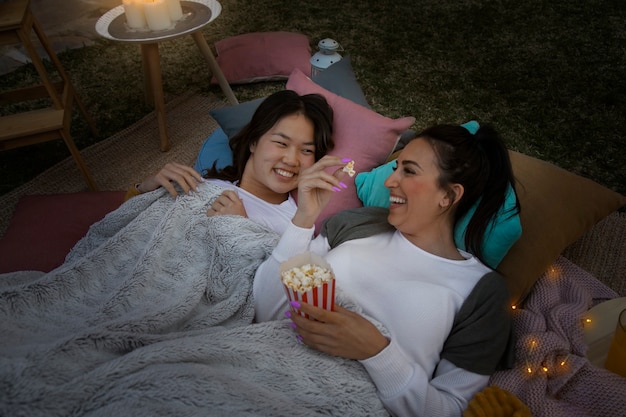 Young friends having fun at cinema in open air