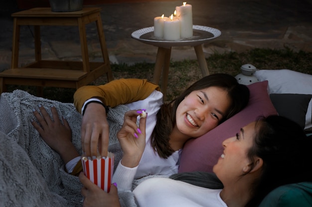 Young friends having fun at cinema in open air