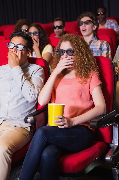 Young friends watching a 3d film