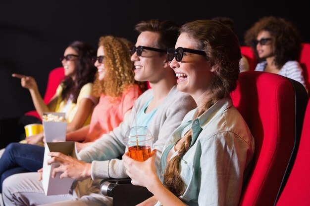 Young friends watching a 3d film