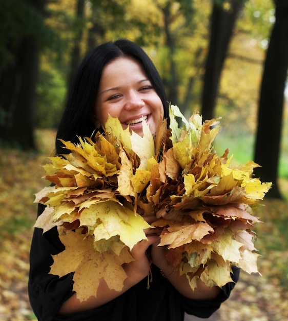 Young girl in autumn park