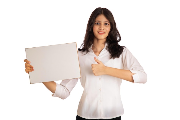 A young girl or businesswoman holding a signboard in her hands on a white background