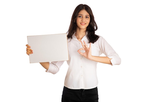 A young girl or businesswoman holding a signboard in her hands on a white background