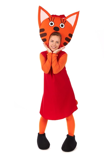 A young girl in a children's entertaining ginger cat costume. Figure isolated on white background.