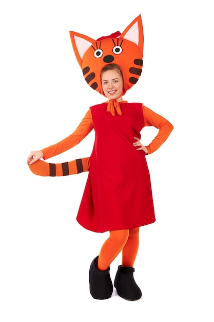 A young girl in a children's entertaining ginger cat costume. Figure isolated on white background.