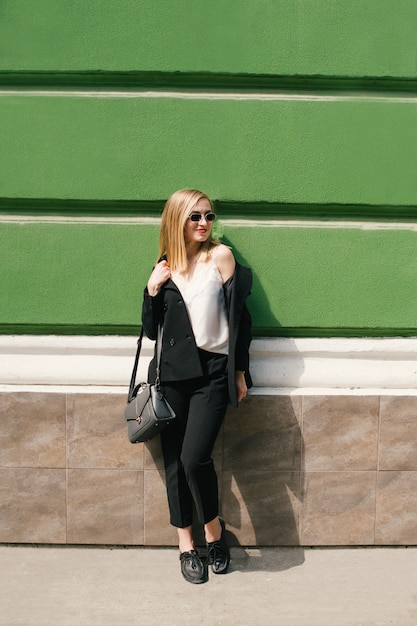 A young girl in a classic suit. Business topics