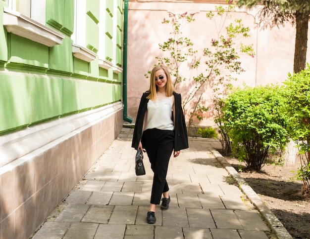 A young girl in a classic suit. Business topics