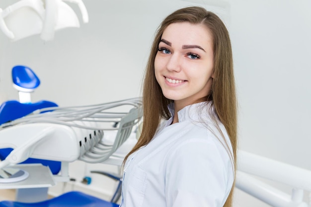 Young girl doctor in the dental office