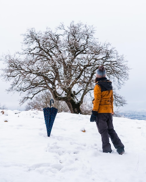 A young girl enjoying a lot in the winter in the snow Snow in the town of Opakua