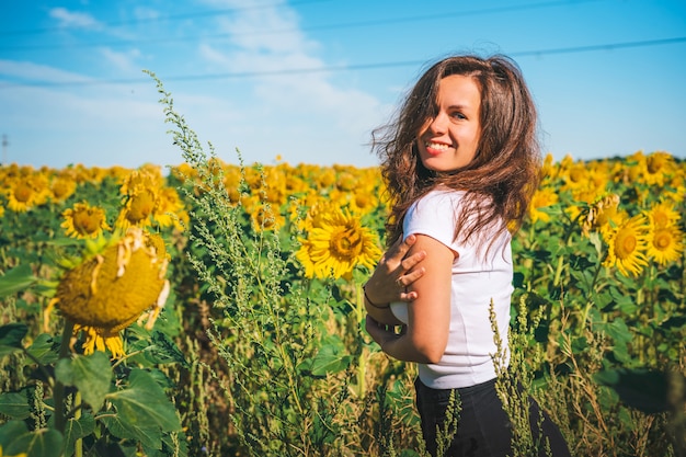 Young girl in a field of sunflowers