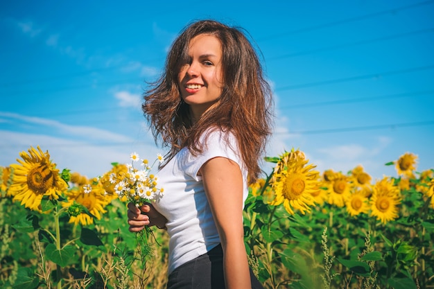 Young girl in a field of sunflowers