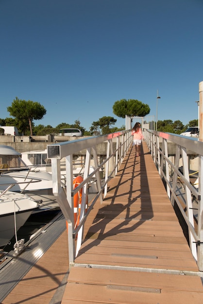 Young girl in an harbour on holidays