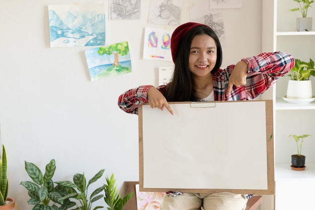 Young girl hold frame and paper at home Hobby and art study at home