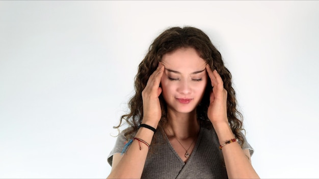 Young Girl Holding Her Head Cause Of Headache Photo