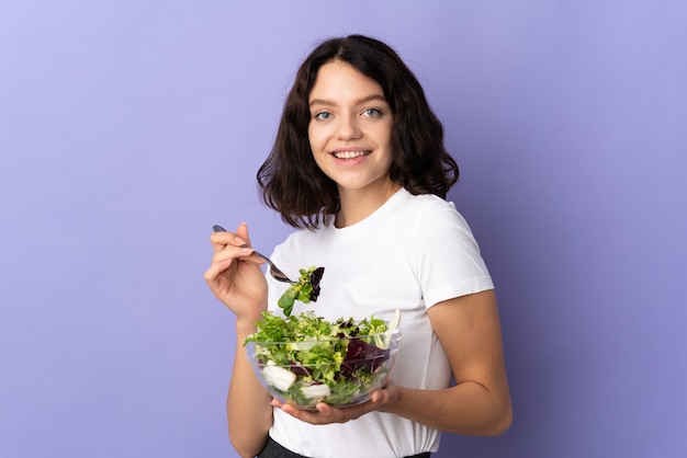 Young girl holding a salad