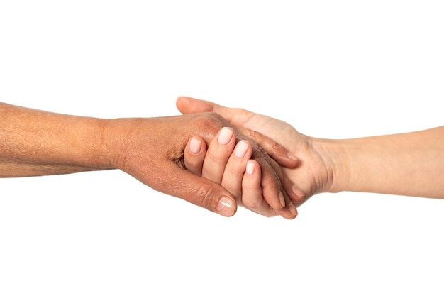 A young girl holds the hand of an elderly woman in her hand. Help concept