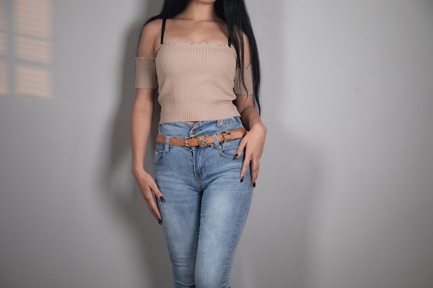 Young girl in jeans posing