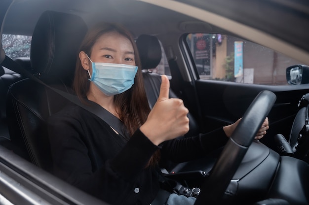 young girl in a mask  in a car