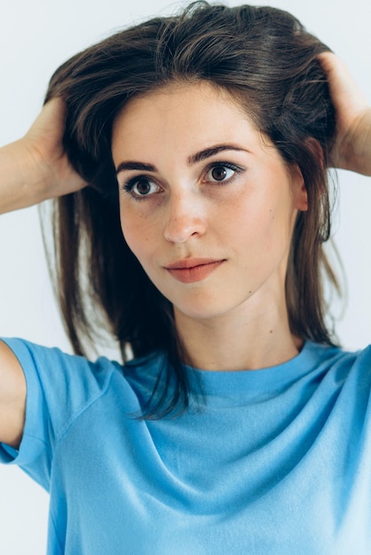 Young girl model in a blue blouse