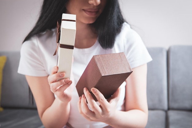 Young girl opens a gift box