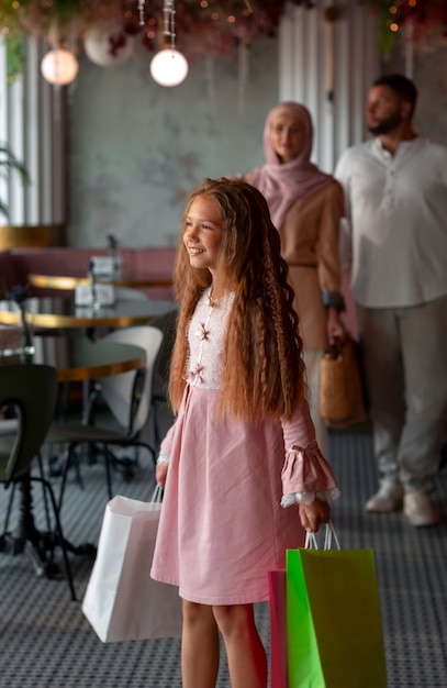 Young girl out for a shopping session with her parents