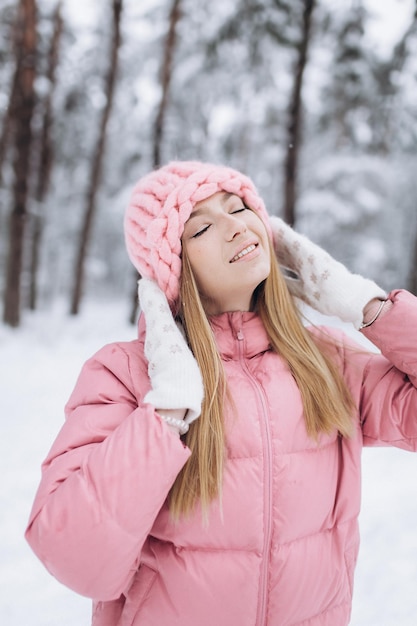 Young girl outdoors in winter snowy park