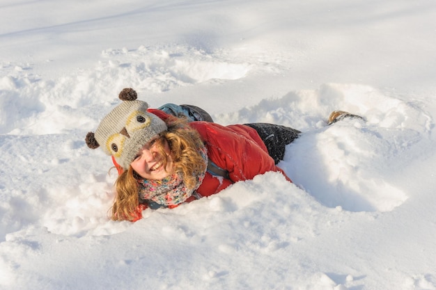 Young girl playing in snow