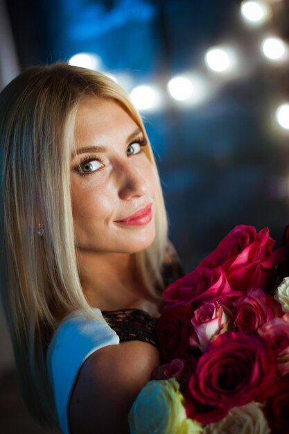 Young girl posing on the background of lights