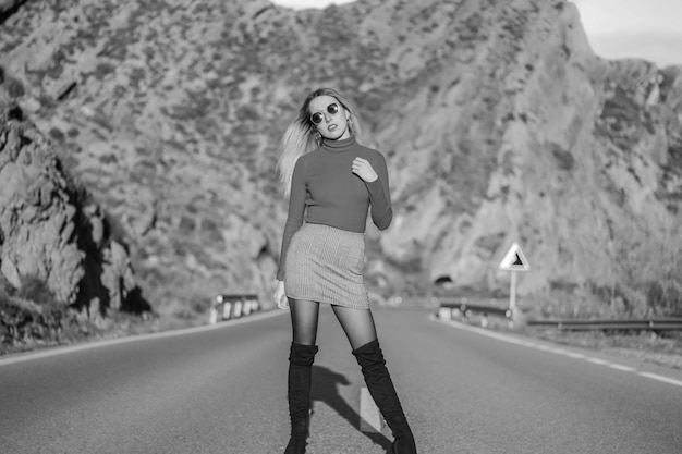 Young girl posing on desert road