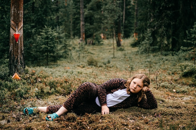 Young girl posing in the forest