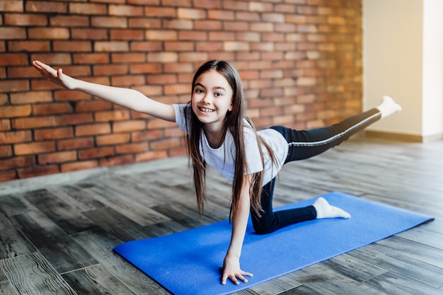 Young girl practicing yoga