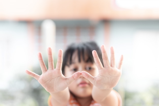 Young girl showing her palms