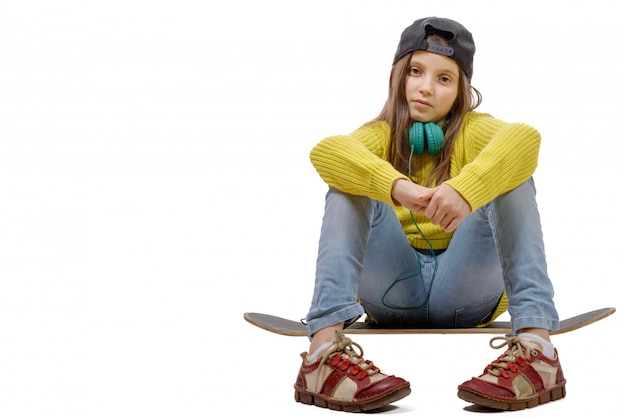 Young girl sitting on skate