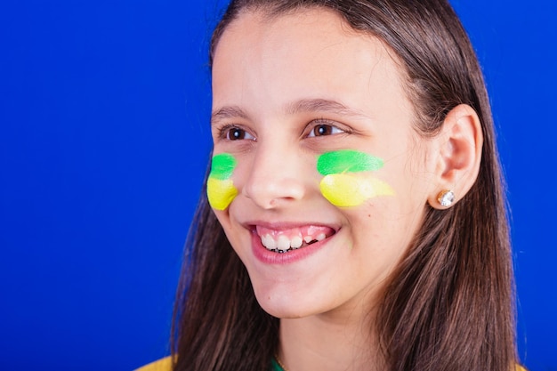 Young girl soccer fan from Brazil closeup photo smiling